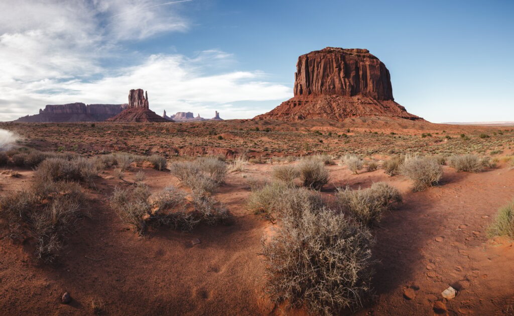 Wide desert landscape with red rock formations